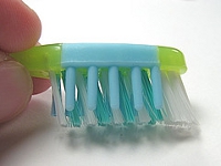 Toothbrush with angled bristles