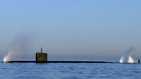 Submarine With Water and Air Gushing from Ballast Tanks