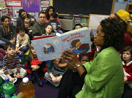 Teacher Reading to Young Students