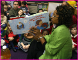 Teacher Reading to Young Students