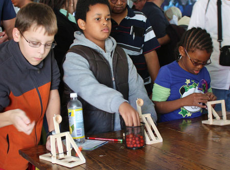 Kids Aim at a Target Using Catapults