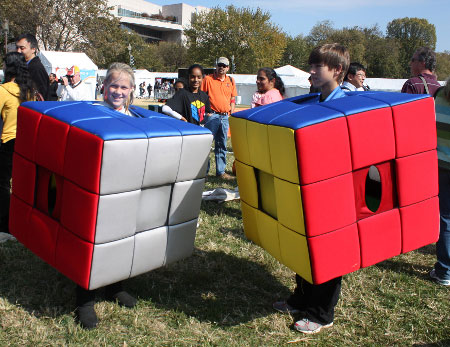 Kids Dress as Rubix Cubes Promote a Contest