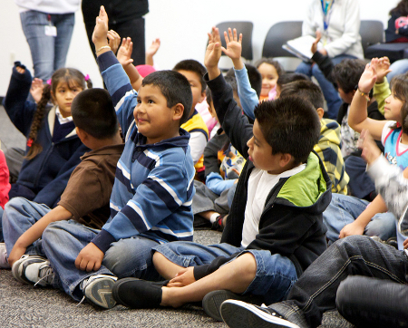 kids raising hands