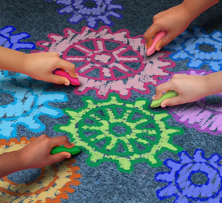 kids drawing chalk gears on sidewalk