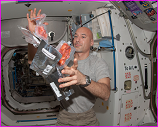 International Space Shuttle astronaut Luca Parmitano juggling food packs