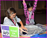 middle school girls in USDA MEDB's 4-H STEM program test boat designs